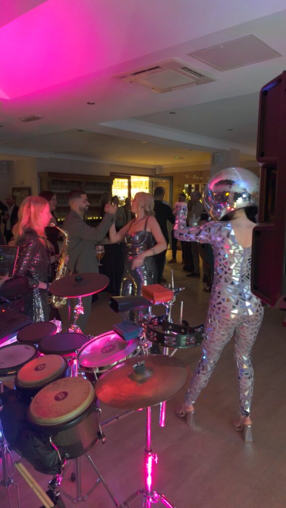 Saxophonist DJ percussion and disco dancer entertaining guests at Windlesham Golf Club party