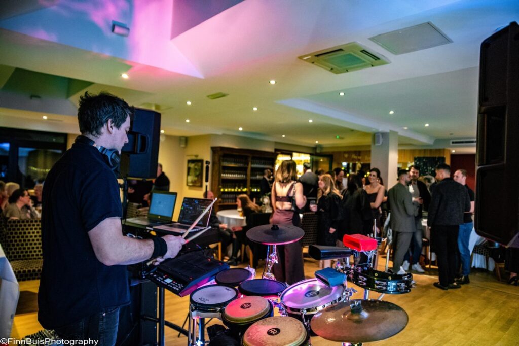 DJ live setup with percussion and crowd at Windlesham Golf Club birthday party Surrey