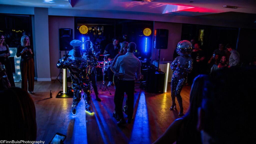 DJ live percussion and disco dancers performing at birthday party at Windlesham Golf Club Surrey