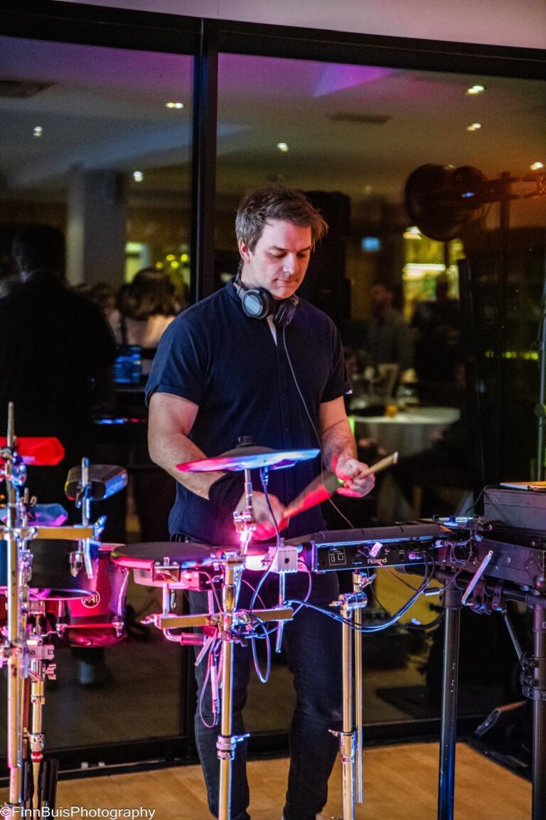 DJ percussionist performing live electronic drums at birthday party Surrey Windlesham Golf Club